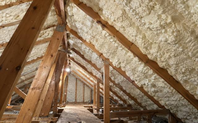 Attic with spray foam between the rafters in Elmira